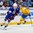 BUFFALO, NEW YORK - JANUARY 4: USA's Adam Fox #8 skates away from Sweden's Oskar Steen #29 with the puck during the semi-final round of the 2018 IIHF World Junior Championship. (Photo by Andrea Cardin/HHOF-IIHF Images)

